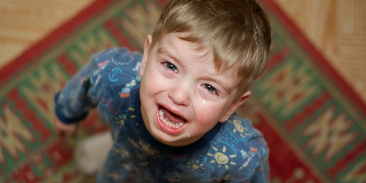 Child crying because he is experiencing growing pains.