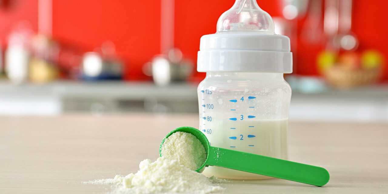 Picture of baby formula in powder form and mixed in a baby bottle.